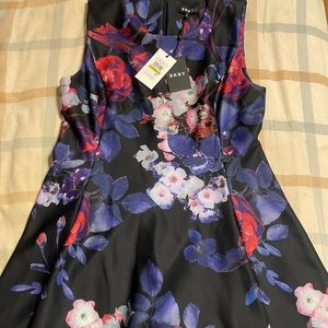 Floral DKNY dress featuring dark tones with a few brighter highlights. Size 14
